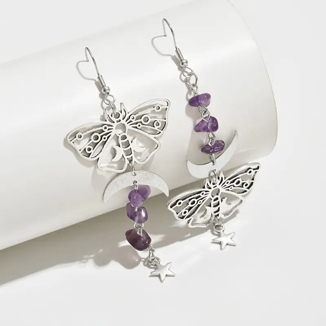 Moth earrings with purple gemstones