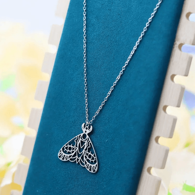Cut out moth necklace