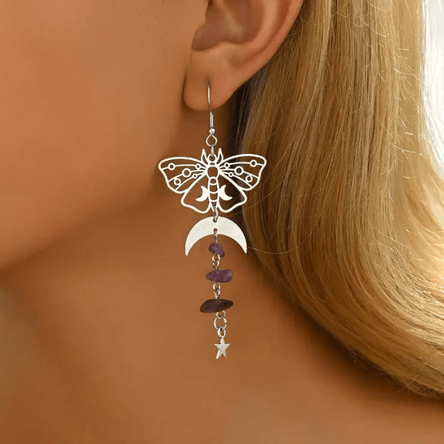 Moth earrings with purple gemstones